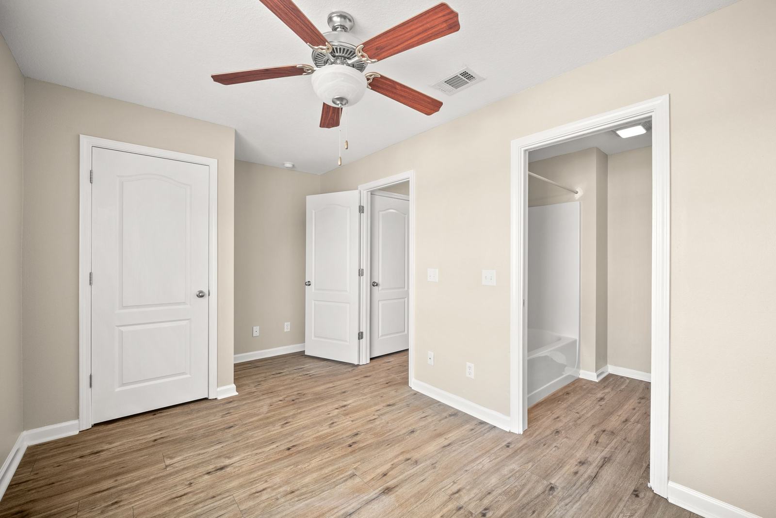 Bedroom with closet and adjoining full bath